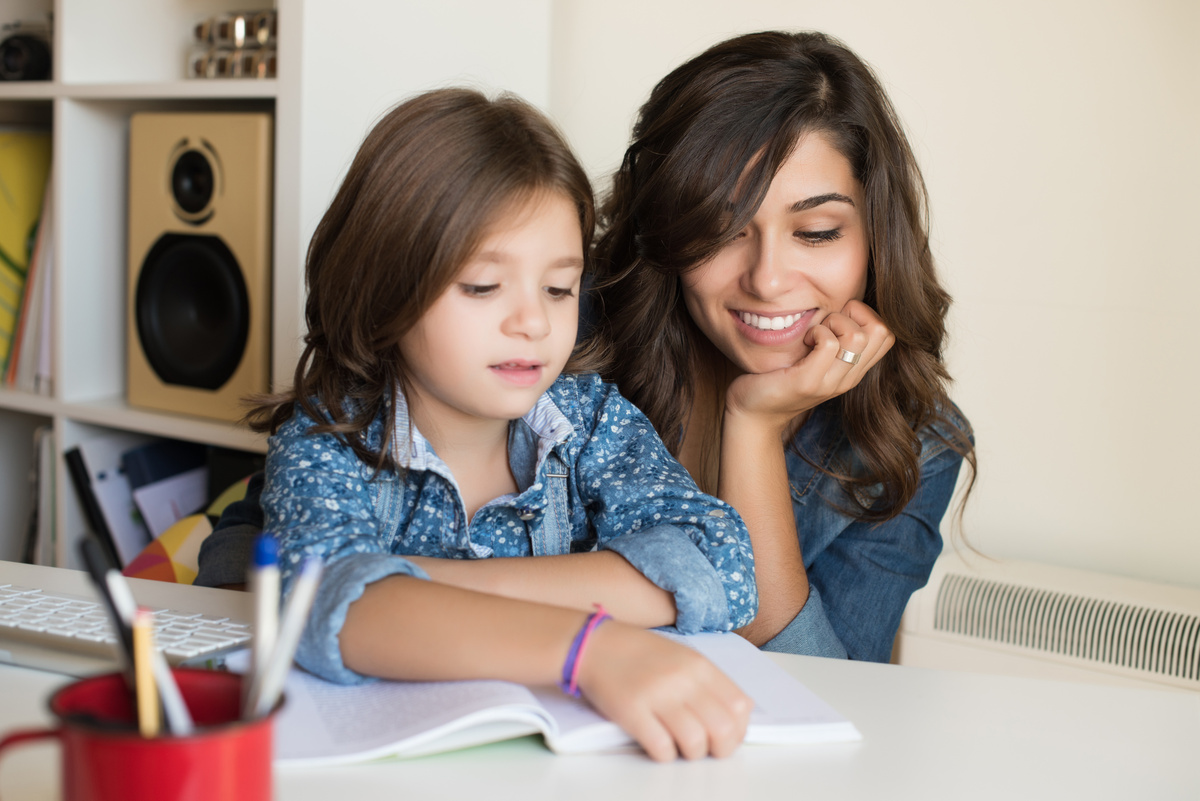 Mother Helping Child with Homework